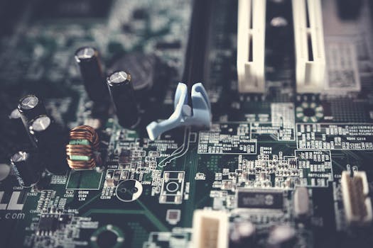 Detailed view of components on a computer motherboard, showcasing technology and circuitry.